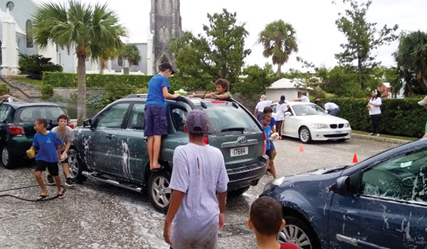 Members of The Bermuda Boys’ Brigade and Girls’ Brigade worked together recently at their annual Christmas Car Wash at St. Paul’s Church car park in Paget, donating their time in order to raise funds to put toward a charitable cause that helps children, with $1,100 raised. 