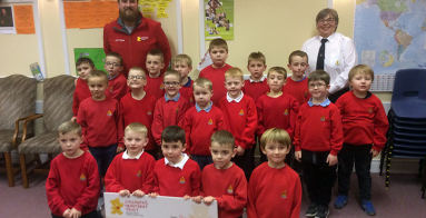Anchor Boys in Northern Ireland present £11,000 cheque to Children's Heartbeat Trust.